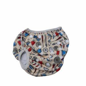 PAÑAL ECOLOGICO BEIGEE DIBUJOS ROJO CELESTE NEGRO